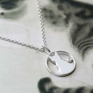 silver cat pendant on plain chain laid