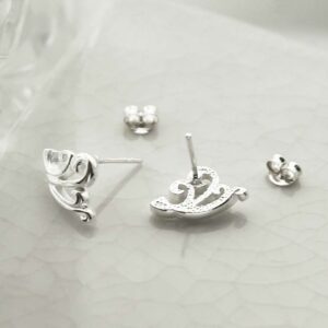 silver swirling pattern studs taken apart