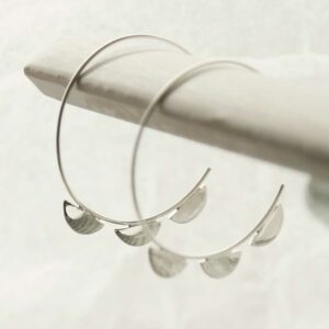 silver three semi circles on hoops hanging