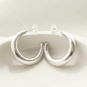 silver large thick hoop studs leaning on bowl rim