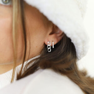 silver three link curb chain drop earrings on model