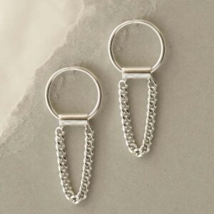 silver curb chain hanging from ring earrings hanging