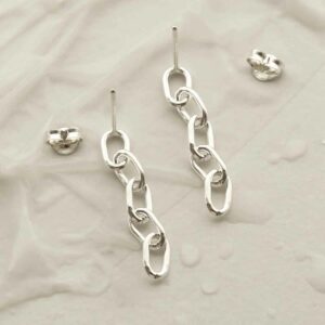 silver five link plain chain drop earrings laid