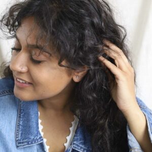 Satellite studs on model wearing denim jacket