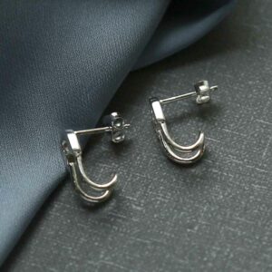 silver safety pin stud bending round sideways view