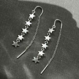 silver five stars dangling on chain threader earrings in shadow