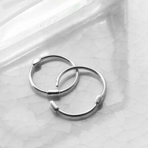 silver plain hoops with bead open on tile