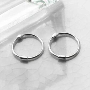 silver plain hoops with bead on tile