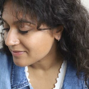 Model Wearing Everyday hoops in denim jacket