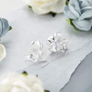 silver flowering pansy studs on paper