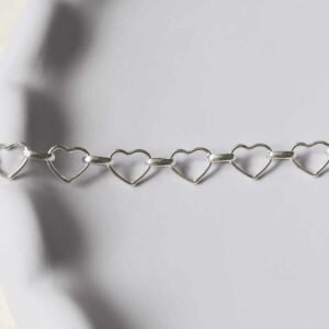 silver heart and circle link bracelet laid straight