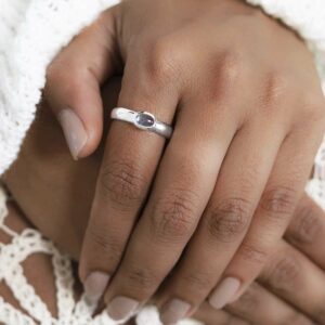 Sterling Silver blue topaz Secret Message Ring on model in white jumper