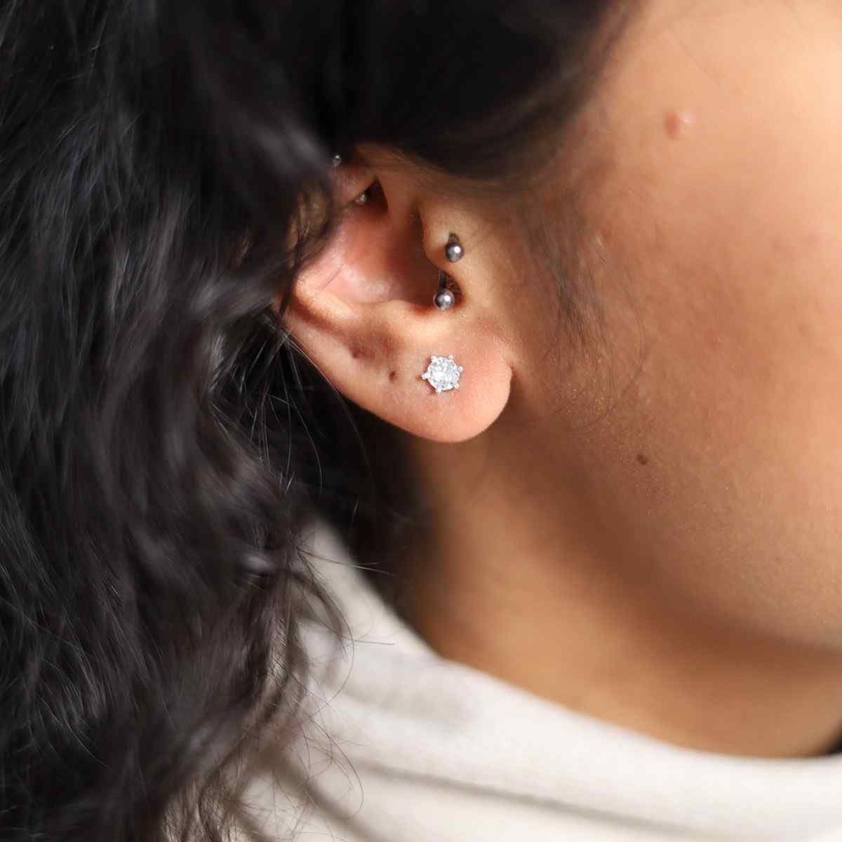 model wearing sterling silver cubic zirconia stud earrings