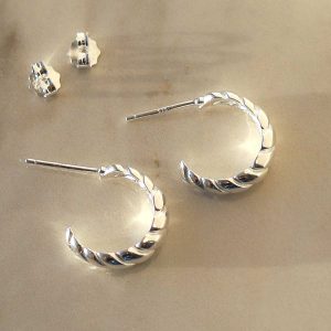 Braided Hoop Stud Earrings on marble background