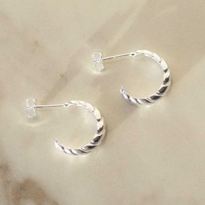 Braided Hoop Stud Earrings on marble background