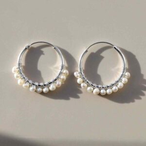 silver hoops with rows of pearls on tile