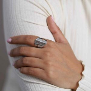 model wearing sterling silver adjustable flat ring