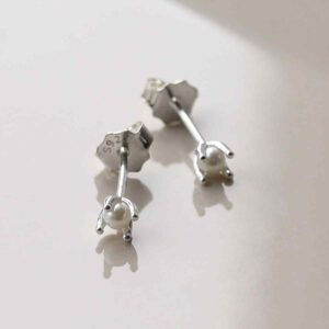 silver tiny basic pearl studs on tile