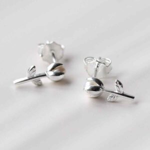 silver tiny basic tulip studs on tile in sunlight