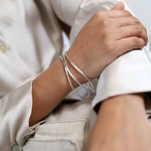 Model wearing sterling silver wire bangle