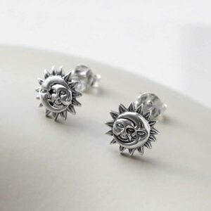 Sterling Silver Sun and Moon Stud Earrings on ceramic background