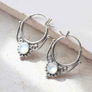 sterling silver mother of pearl drop hoop earrings ceramic and paint background