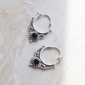 sterling silver onyx drop hoop earrings ceramic and paint background