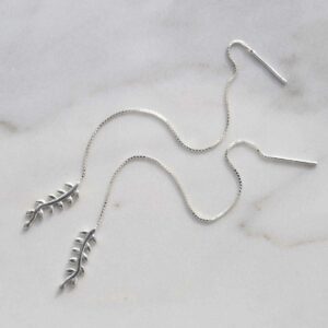 Sterling Silver Fern Threader Earrings on ceramic background