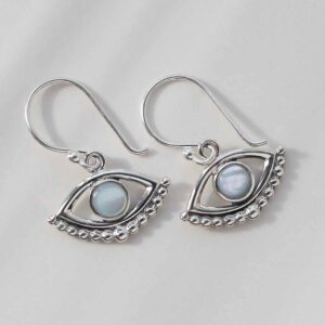 Mother of Pearl Evil eye earrings on ceramic background