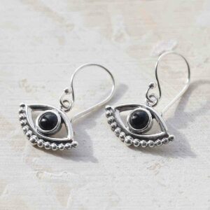 Onyx Evil eye earrings ceramic and paint background