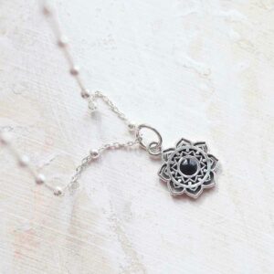 Onyx moroccan flower necklace ceramic and paint background