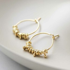 Gold Plated Silver Boho Hoops on ceramic background