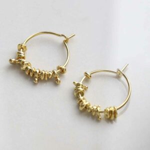 Gold Plated Silver Boho Hoops on ceramic background