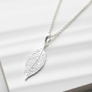 Sterling Silver New Leaf Necklace on ceramic