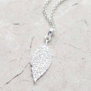 Sterling Silver New Leaf Necklace on ceramic