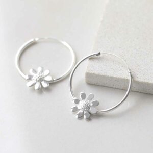 Sterling Silver Daisy Hoop Earrings on ceramic