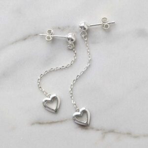 Sterling Silver Heart Drop Threader Earrings on marble background