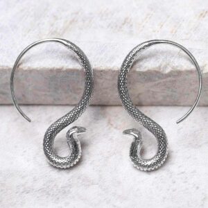 Sterling Silver Cobra Drop Earrings propped up on ceramic background