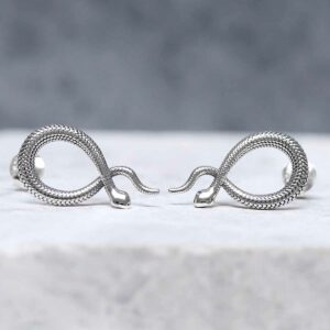 Sterling Silver Snake Stud Earrings on grey background