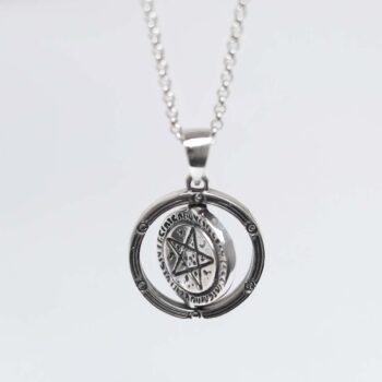Product photo of sterling silver puzzle pendant on plain background