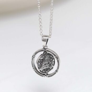 Product photo of sterling silver puzzle pendant on plain background