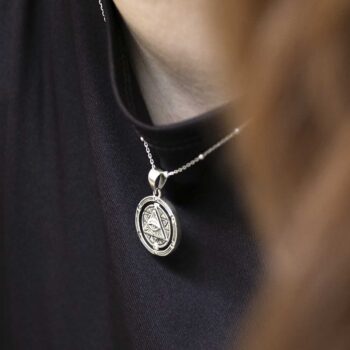 Sterling silver puzzle pendant on model