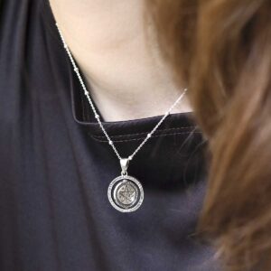 Sterling silver puzzle pendant on model