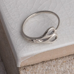 Sterling Silver Scissor Ring on a white tile background.