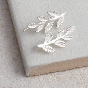 Sterling Silver Leaf Ear Climbers on a white background.