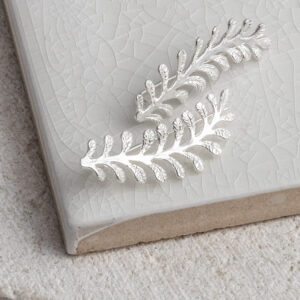 Sterling Silver Vine Ear Climber on a white background.