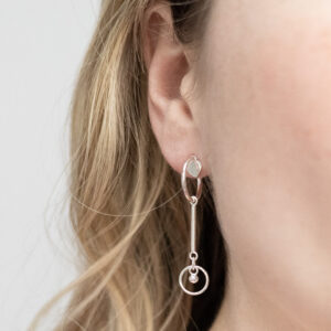 Sterling Silver Heart and Bar Studs worn by a model.