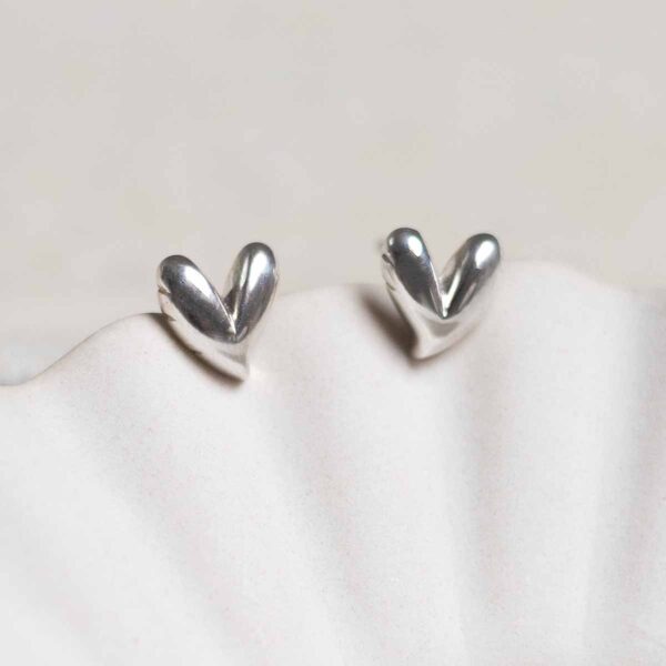 Sterling Silver Love Heart Studs on jewellery dish