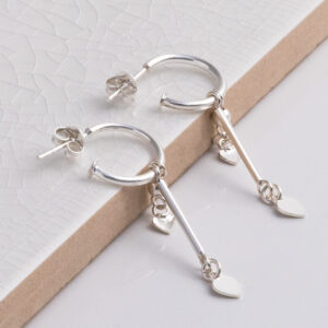 Sterling Silver Double Heart and Bar Studs on a white tile background.