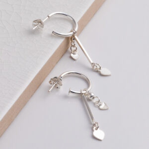 Sterling Silver Double Heart and Bar Studs on a white tile background.